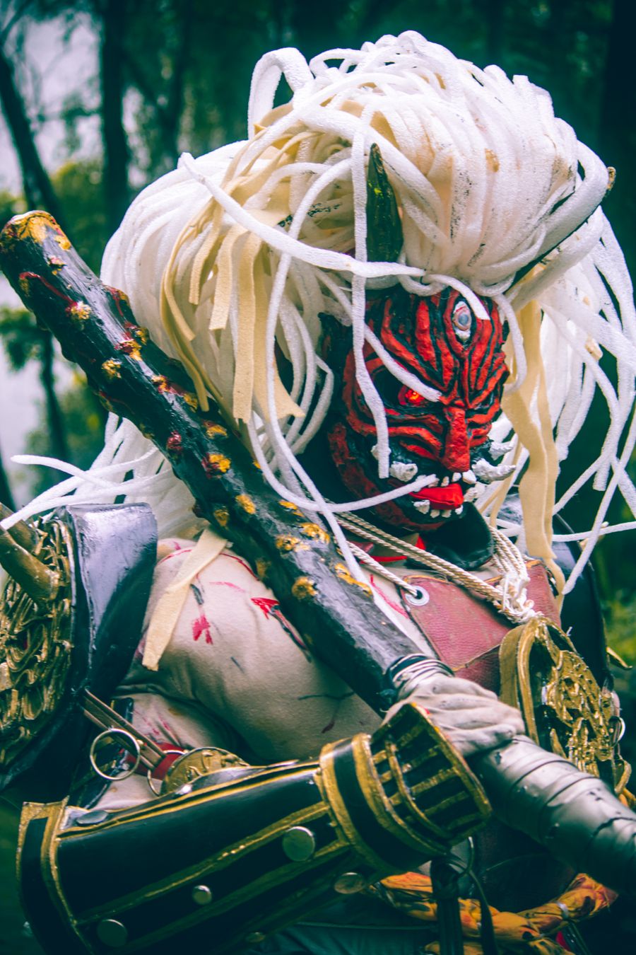 Masked warrior in forest light — contemporary chambara